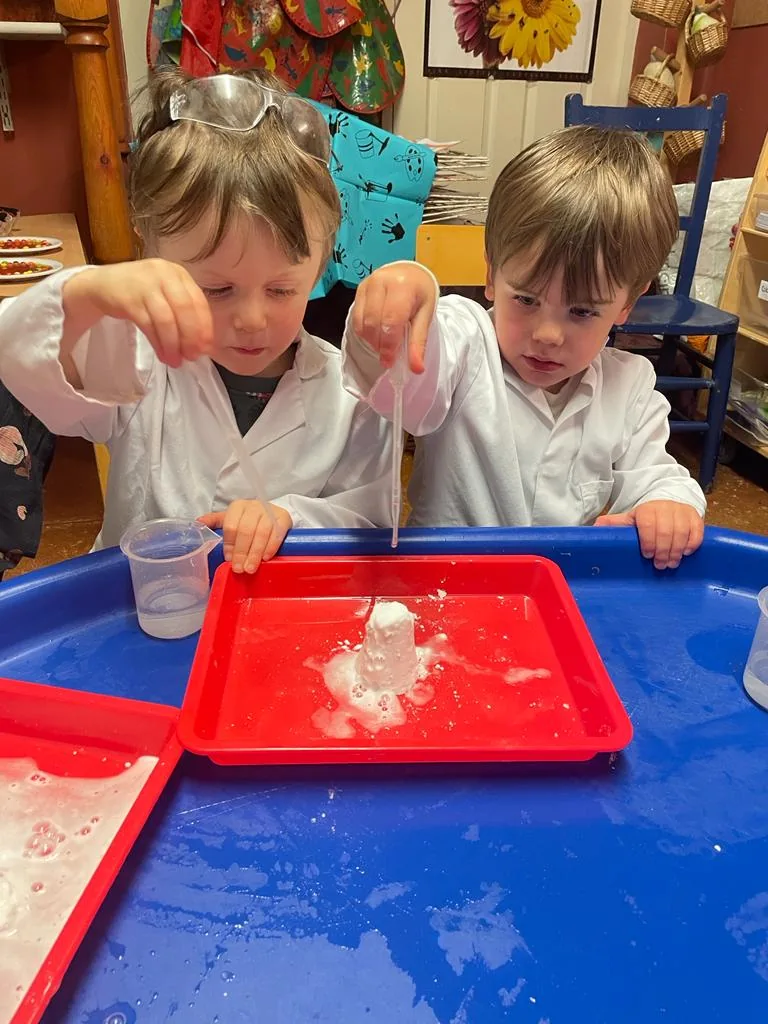 Children exploring ice and water
