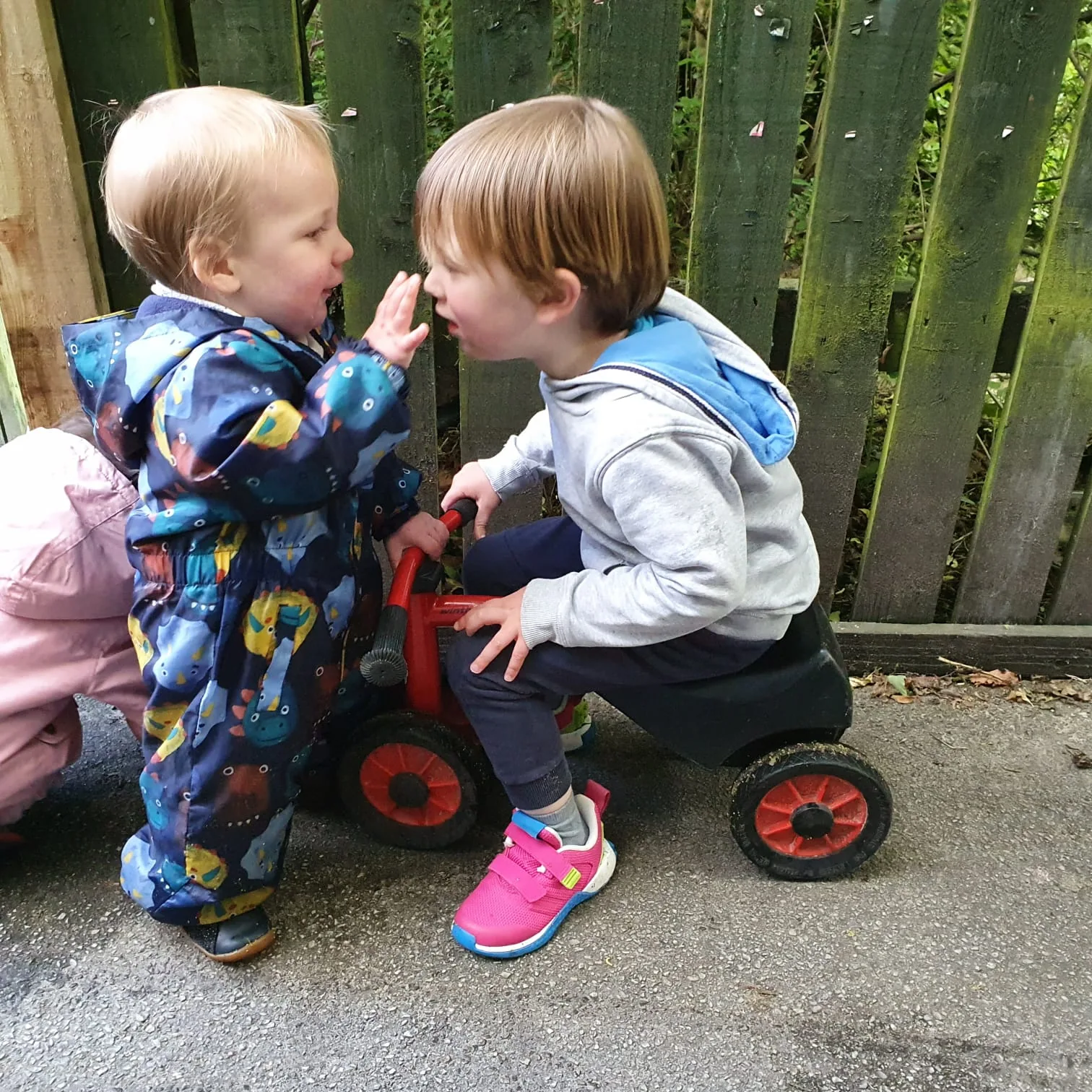 Children sharing a friendly outdoor moment