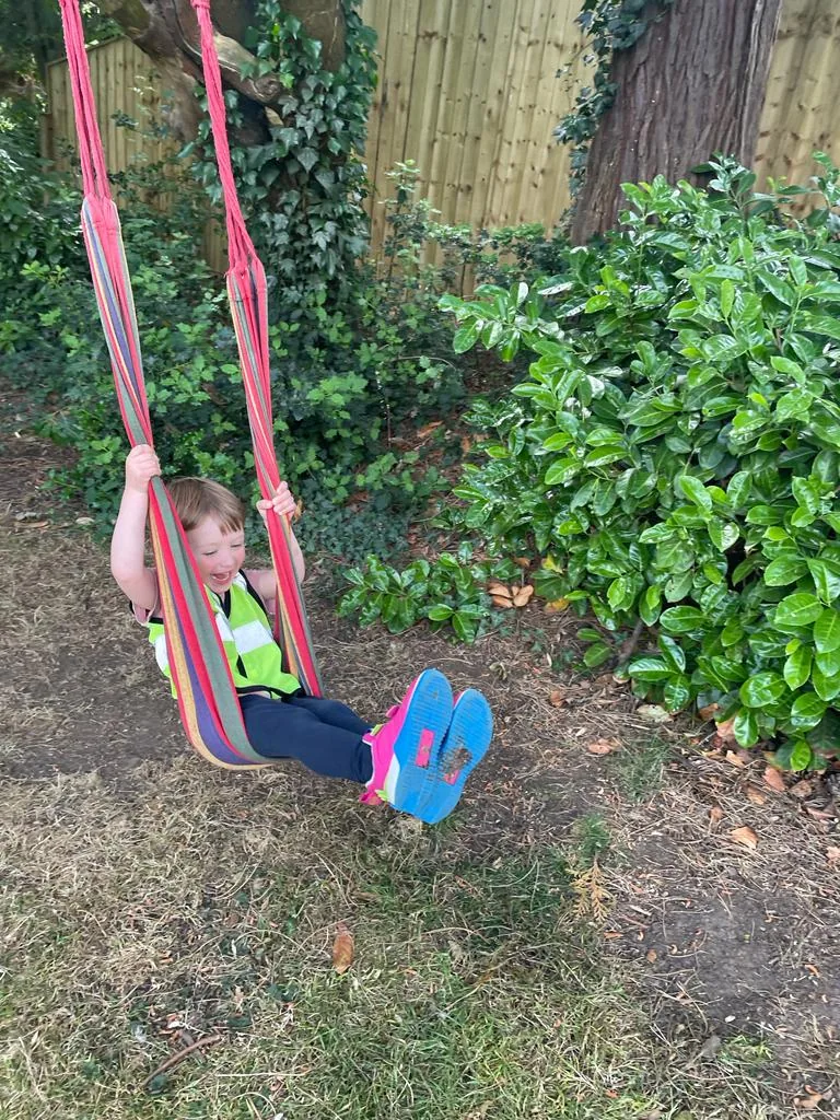 A child enjoying the Riverside swing