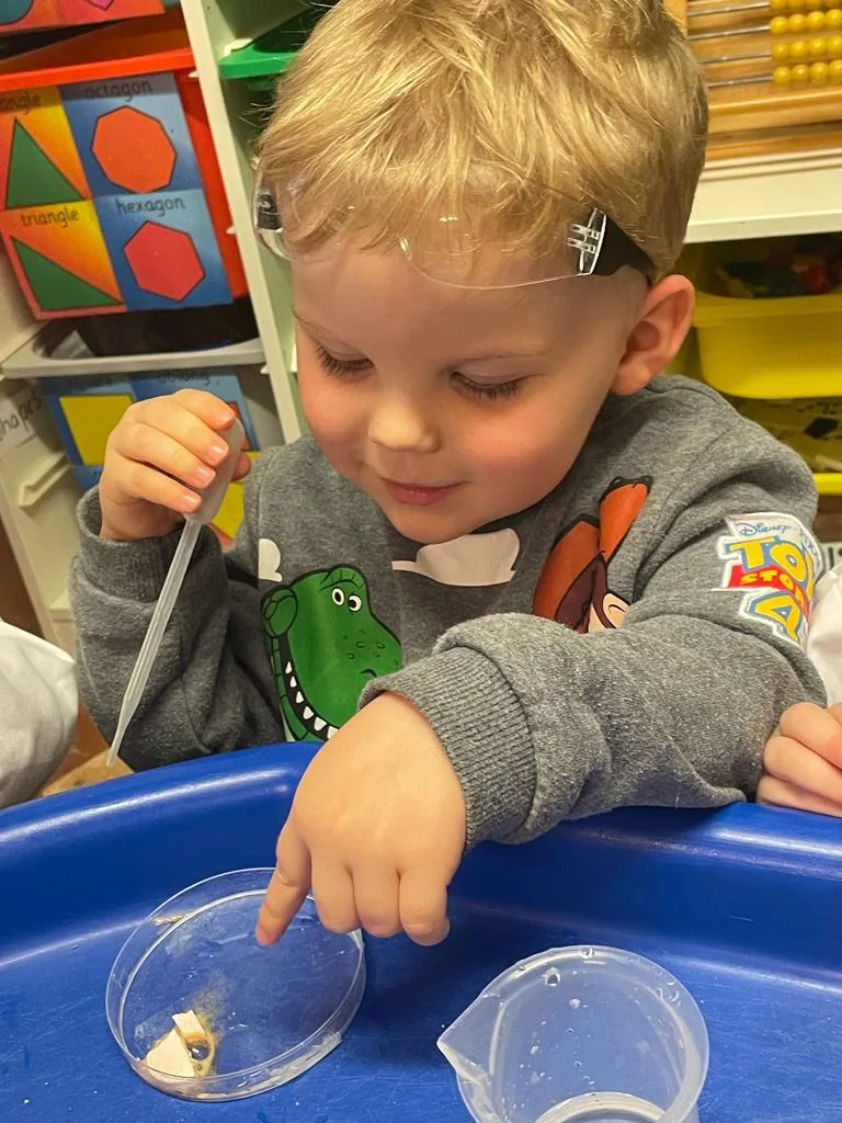 Pre-school children concentrating on a Riverside investigation