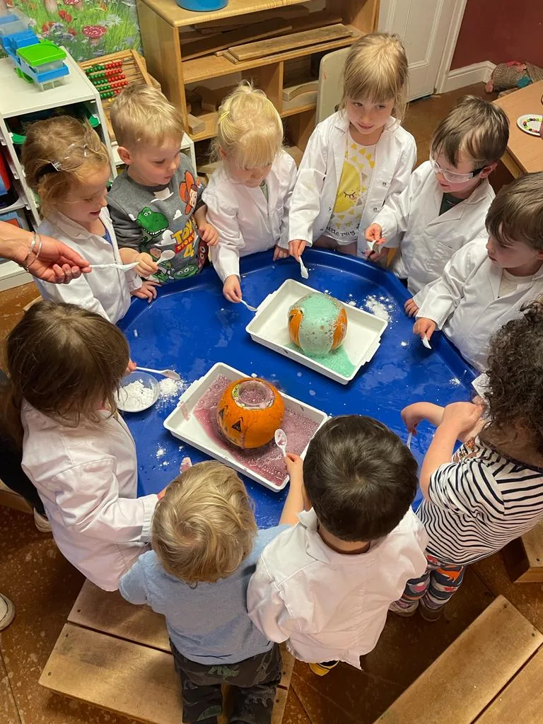 Riverside children carrying out a science experiment together